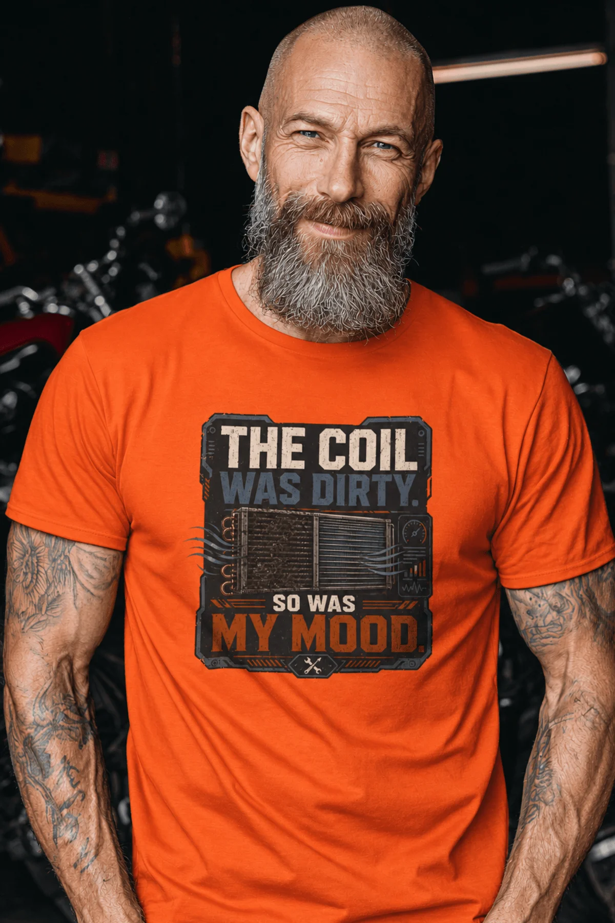 HVAC Technician Tee — “THE COIL WAS DIRTY. SO WAS MY MOOD.” — orange — Model HVAC Technician Tee — “THE COIL WAS DIRTY. SO WAS MY MOOD.” — orange t-shirt, model photo | Pressure Tested Co