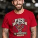 Plumber T-Shirt — "Pipe Doctor. No Appointment Needed" Vintage Work Shirt — red — Model Plumber T-Shirt — "Pipe Doctor. No Appointment Needed" Vintage Work Shirt — red t-shirt, model photo | Pressure Tested Co