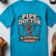 Plumber T-Shirt — "Pipe Doctor. No Appointment Needed" Vintage Work Shirt — sapphire — Flat-lay Plumber T-Shirt — "Pipe Doctor. No Appointment Needed" Vintage Work Shirt — sapphire t-shirt, flat-lay product photo | Pressure Tested Co