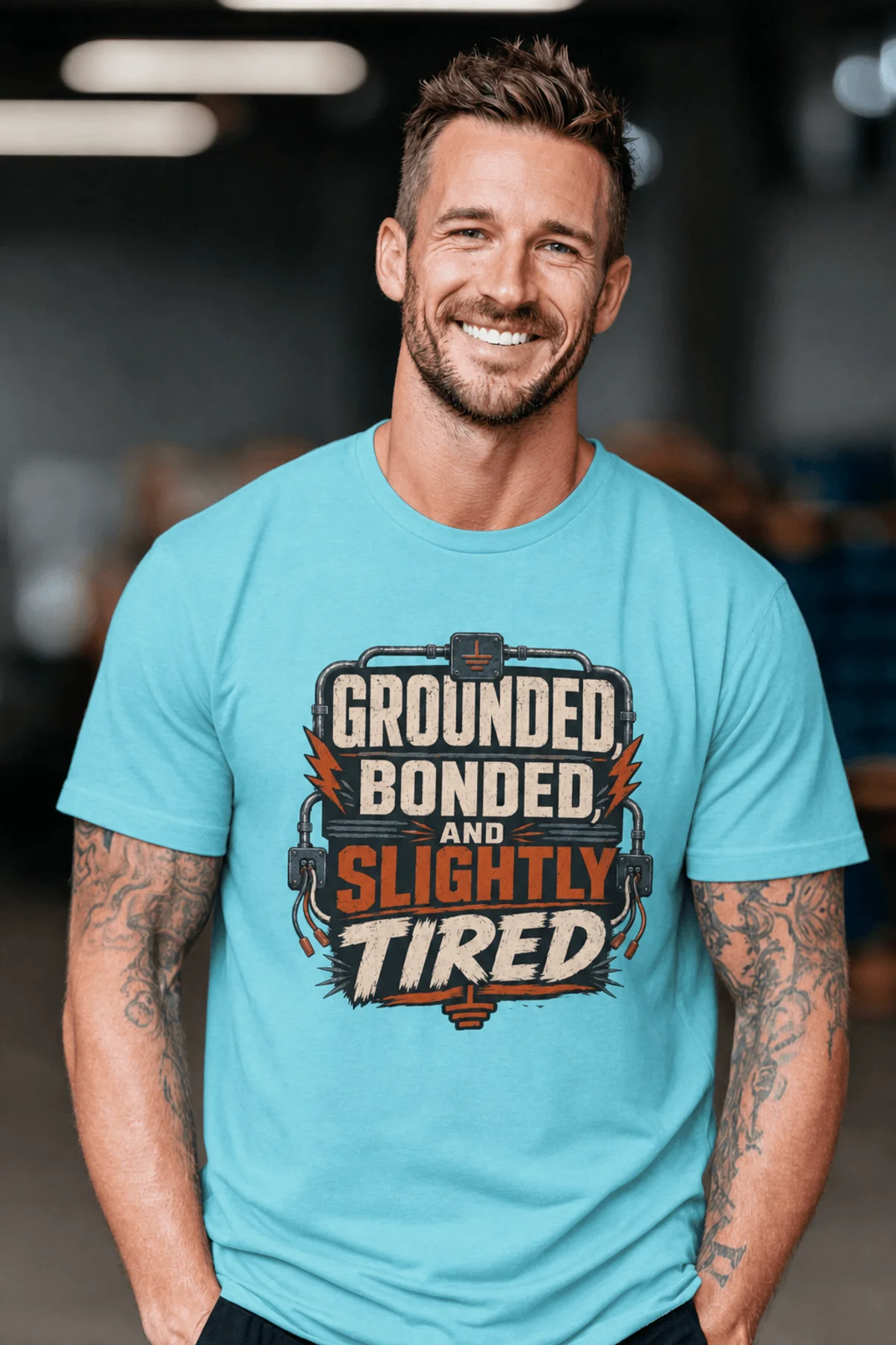Grounded, Bonded and Slightly Tired Graphic Tee — Funny Electrical Worker Shirt — turquoise t-shirt, model photo | Pressure Tested Co
