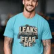 Leaks Fear Me T-Shirt - Funny Plumber Pipes Tee — turquoise t-shirt, model photo | Pressure Tested Co