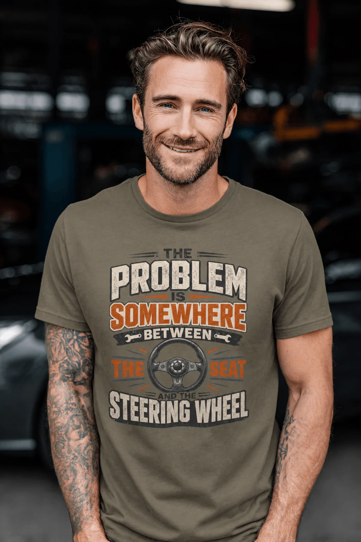 Driving Humor T-Shirt — "The Problem Is Somewhere Between The Seat And The Steering Wheel" — army t-shirt, model photo | Pressure Tested Co