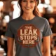 "The Leak Stops Here" Stop Sign Badge Style — Plumbing Repair Tech Humorous Tee — asphalt t-shirt, model photo | Pressure Tested Co