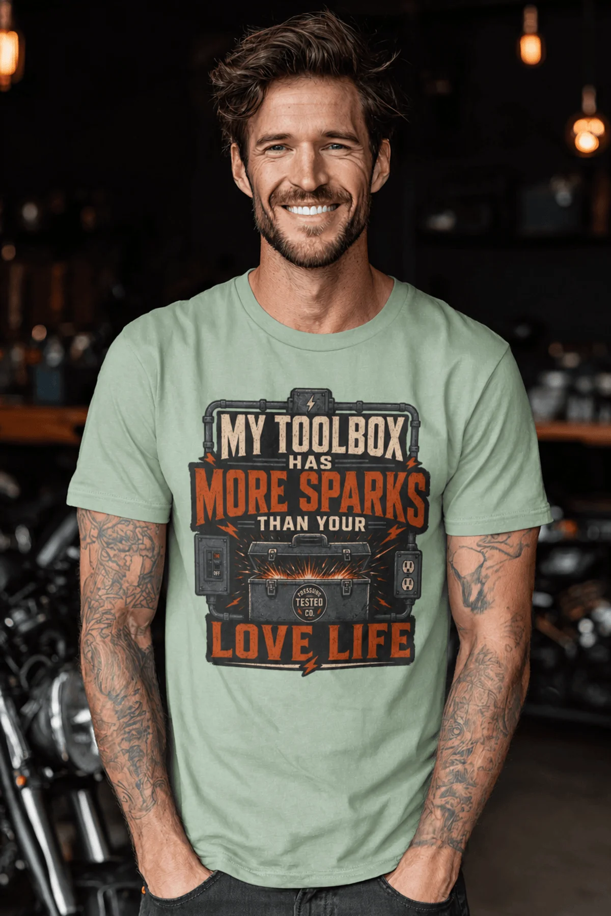T-Shirt — "My Toolbox Has More Sparks Than Your Love Life" Electrician/Mechanic Workshop Tee — bay t-shirt, model photo | Pressure Tested Co