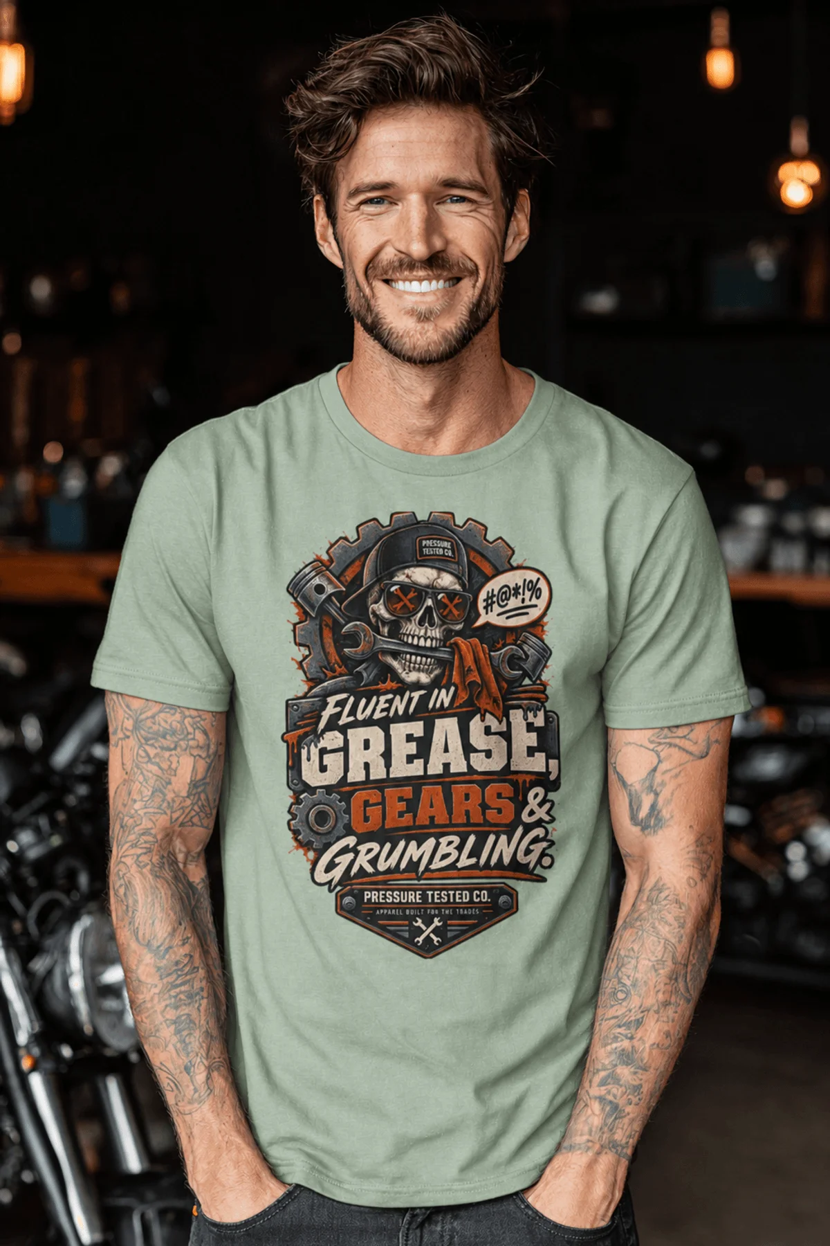 Mechanic Skull T-Shirt — "Fluent in Grease, Gears and Grumbling" Graphic Tee — bay t-shirt, model photo | Pressure Tested Co