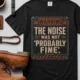 Warning Sign T-Shirt — "The Noise Was Not 'Probably Fine'" Vintage Graphic Tee — black t-shirt, flat-lay product photo | Pressure Tested Co