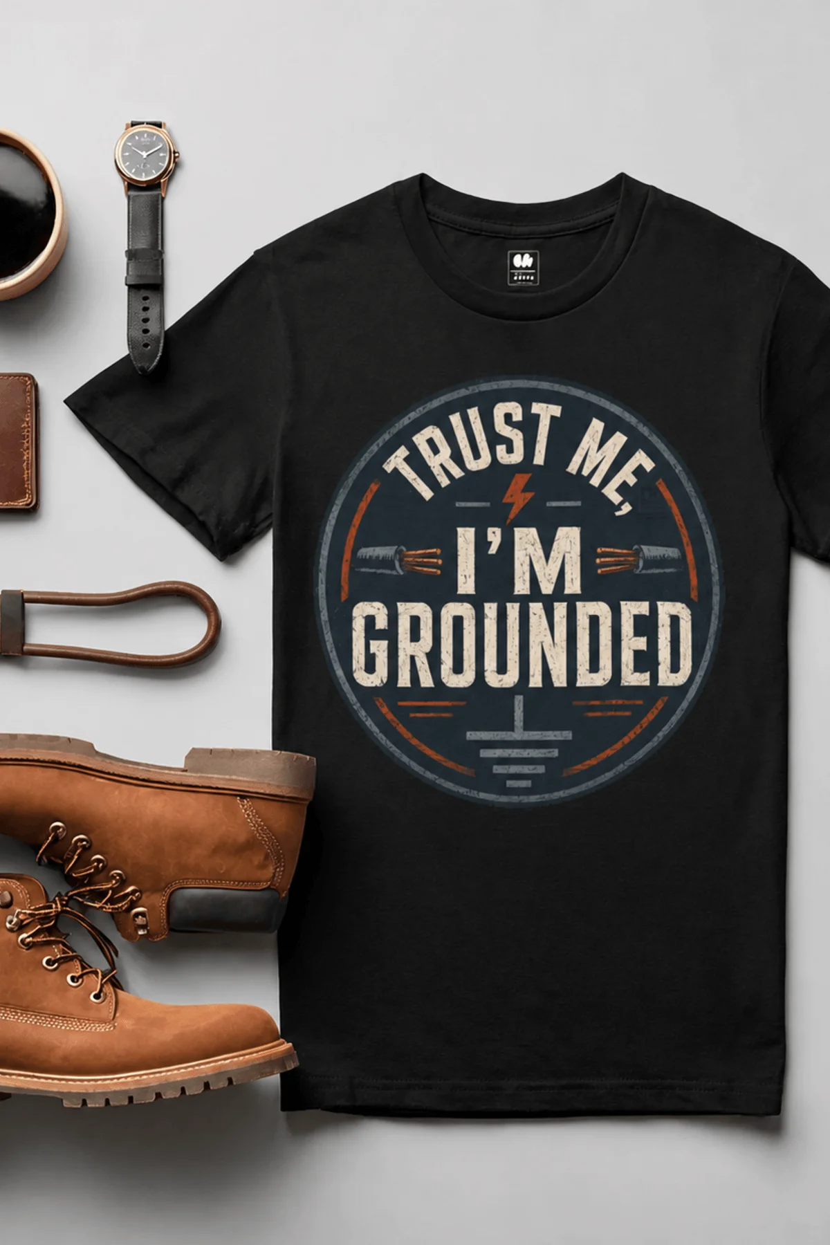 Grounded T‑Shirt – "Trust Me I'm Grounded" Electrical Tech Tee — black t-shirt, flat-lay product photo | Pressure Tested Co