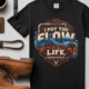 'I Put The Flow Back Into Your Life.' T-Shirt — Funny Retro Industrial Plumber's Tee — black t-shirt, flat-lay product photo | Pressure Tested Co