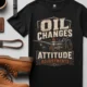 'Oil Changes and Attitude Adjustments' T-Shirt — Funny Retro Industrial Mechanic's Tee — black t-shirt, flat-lay product photo | Pressure Tested Co