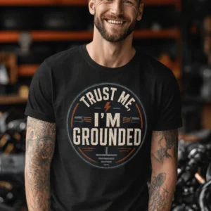 Grounded T‑Shirt – "Trust Me I'm Grounded" Electrical Tech Tee — black t-shirt, model photo | Pressure Tested Co