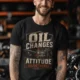'Oil Changes and Attitude Adjustments' T-Shirt — Funny Retro Industrial Mechanic's Tee — black t-shirt, model photo | Pressure Tested Co