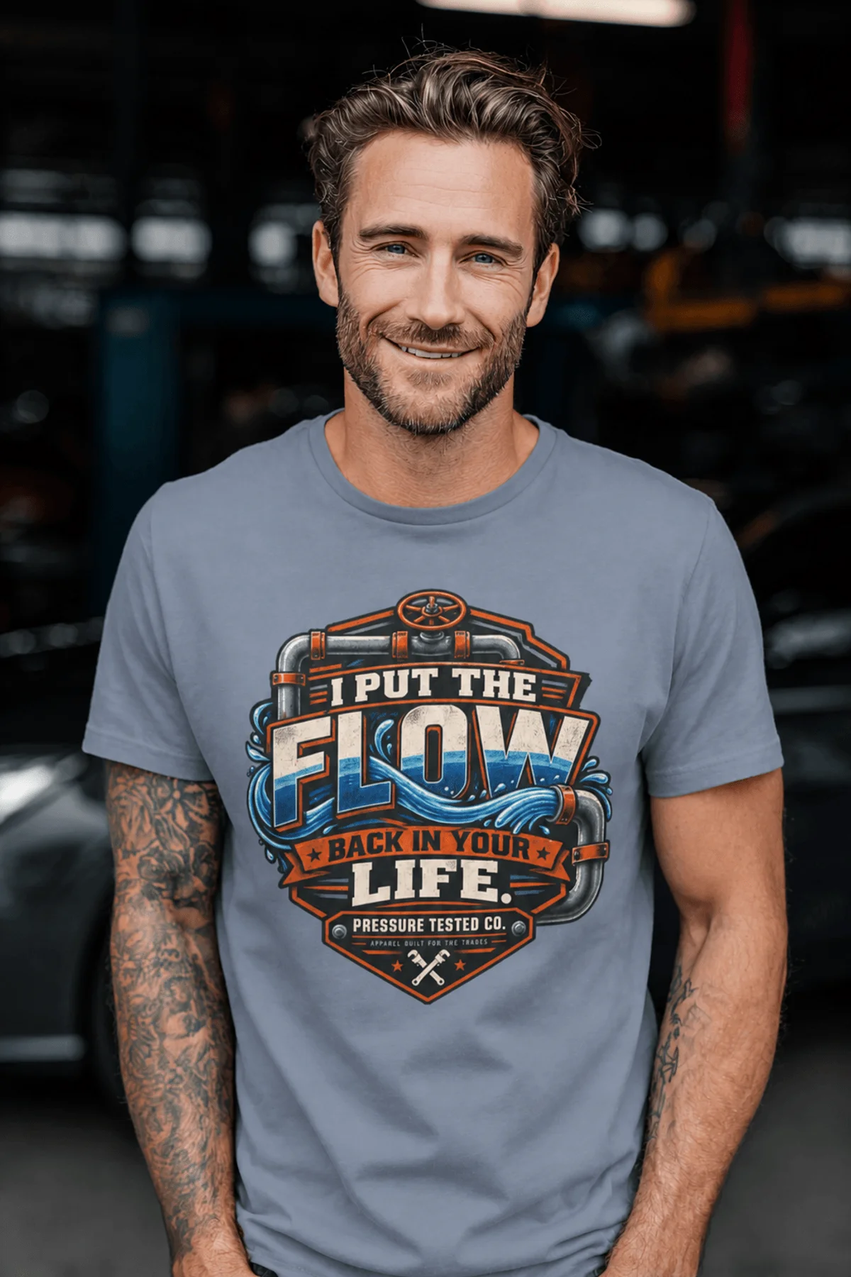 'I Put The Flow Back Into Your Life.' T-Shirt — Funny Retro Industrial Plumber's Tee — blue-jean t-shirt, model photo | Pressure Tested Co