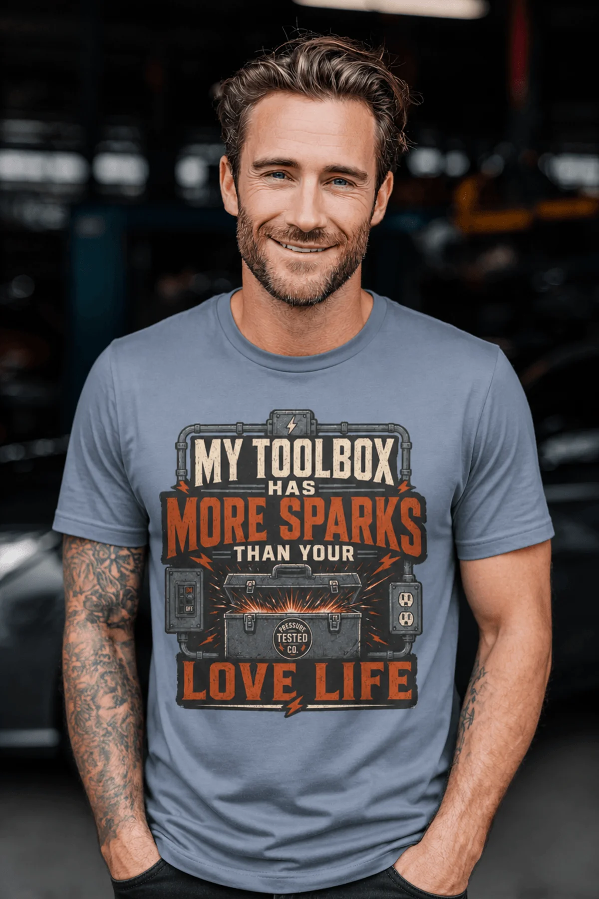T-Shirt — "My Toolbox Has More Sparks Than Your Love Life" Electrician/Mechanic Workshop Tee — blue-jean t-shirt, model photo | Pressure Tested Co