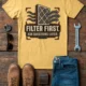 T-Shirt — "Filter First. Ask Questions Later." HVAC Air Filter Graphic — butter t-shirt, flat-lay product photo | Pressure Tested Co