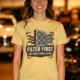 T-Shirt — "Filter First. Ask Questions Later." HVAC Air Filter Graphic — butter t-shirt, model photo | Pressure Tested Co