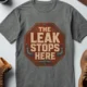 "The Leak Stops Here" Stop Sign Badge Style — Plumbing Repair Tech Humorous Tee — deep-heather t-shirt, flat-lay product photo | Pressure Tested Co