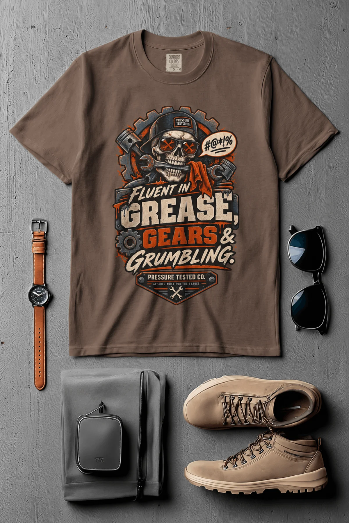 Mechanic Skull T-Shirt — "Fluent in Grease, Gears and Grumbling" Graphic Tee — espresso t-shirt, flat-lay product photo | Pressure Tested Co