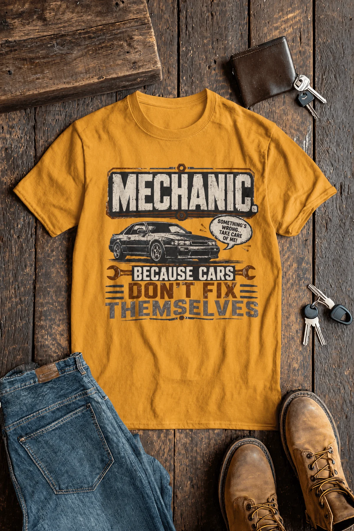 Mechanic Tee — "Mechanic. Because Cars Don't Fix Themselves" Funny Vintage Auto Technician Repair Shirt — gold t-shirt, flat-lay product photo | Pressure Tested Co