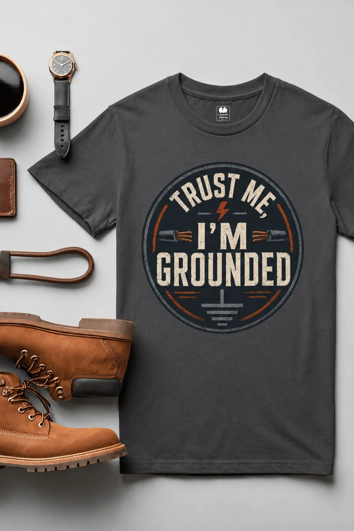 Grounded T‑Shirt – "Trust Me I'm Grounded" Electrical Tech Tee — graphite t-shirt, flat-lay product photo | Pressure Tested Co