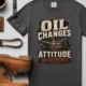 'Oil Changes and Attitude Adjustments' T-Shirt — Funny Retro Industrial Mechanic's Tee — graphite t-shirt, flat-lay product photo | Pressure Tested Co