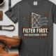 T-Shirt — "Filter First. Ask Questions Later." HVAC Air Filter Graphic — graphite t-shirt, flat-lay product photo | Pressure Tested Co