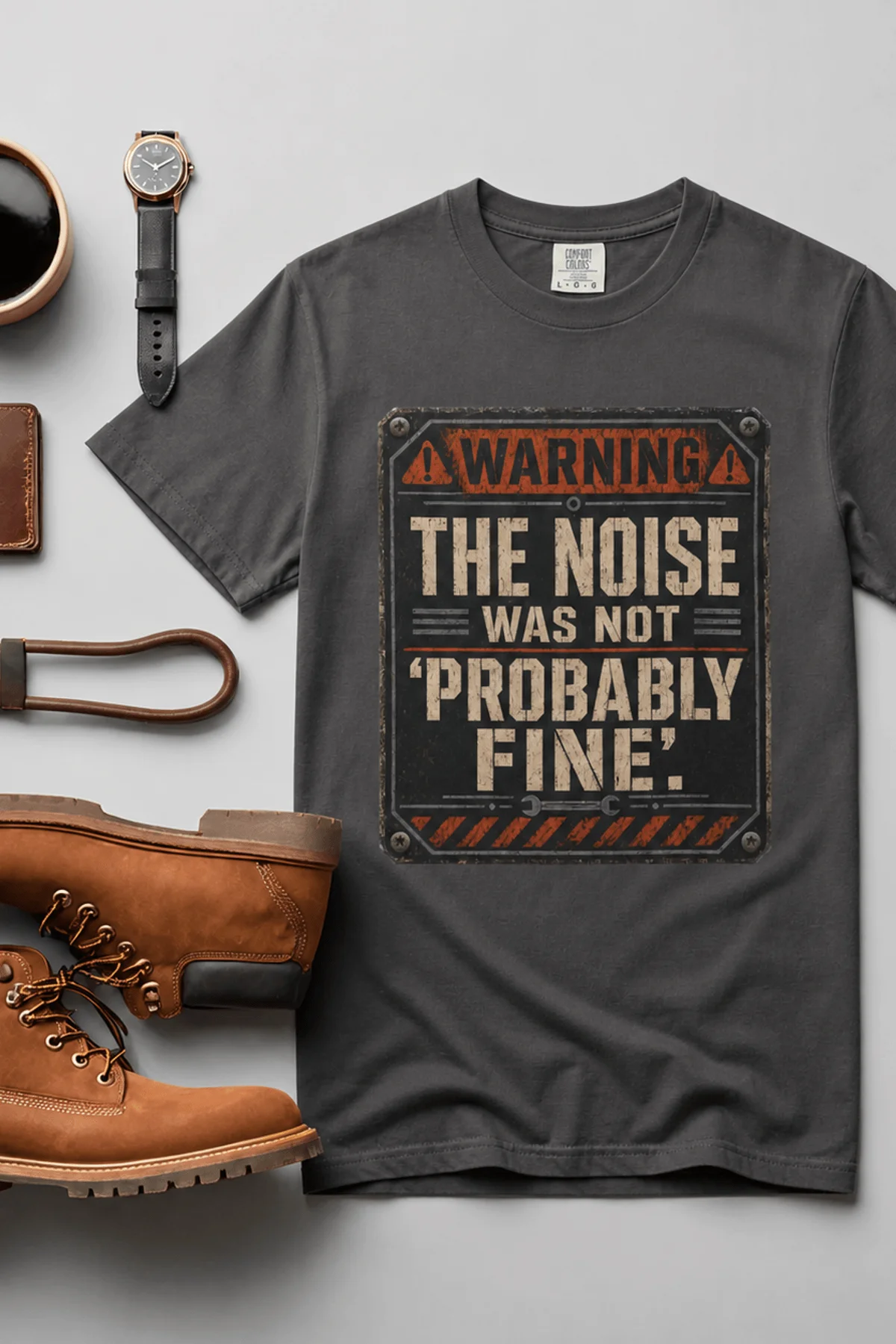 Warning Sign T-Shirt — "The Noise Was Not 'Probably Fine'" Vintage Graphic Tee — graphite t-shirt, flat-lay product photo | Pressure Tested Co