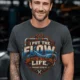 'I Put The Flow Back Into Your Life.' T-Shirt — Funny Retro Industrial Plumber's Tee — graphite t-shirt, model photo | Pressure Tested Co