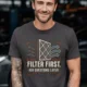 T-Shirt — "Filter First. Ask Questions Later." HVAC Air Filter Graphic — graphite t-shirt, model photo | Pressure Tested Co