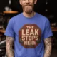 "The Leak Stops Here" Stop Sign Badge Style — Plumbing Repair Tech Humorous Tee — heather-columbia-blue t-shirt, model photo | Pressure Tested Co