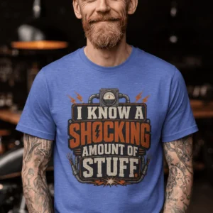 I Know A Shocking Amount Of Stuff T-Shirt — Electrician Science Humorous Tee — heather-columbia-blue t-shirt, model photo | Pressure Tested Co