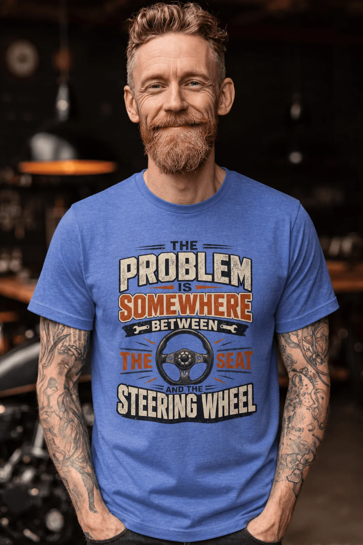 Driving Humor T-Shirt — "The Problem Is Somewhere Between The Seat And The Steering Wheel" — heather-columbia-blue t-shirt, model photo | Pressure Tested Co