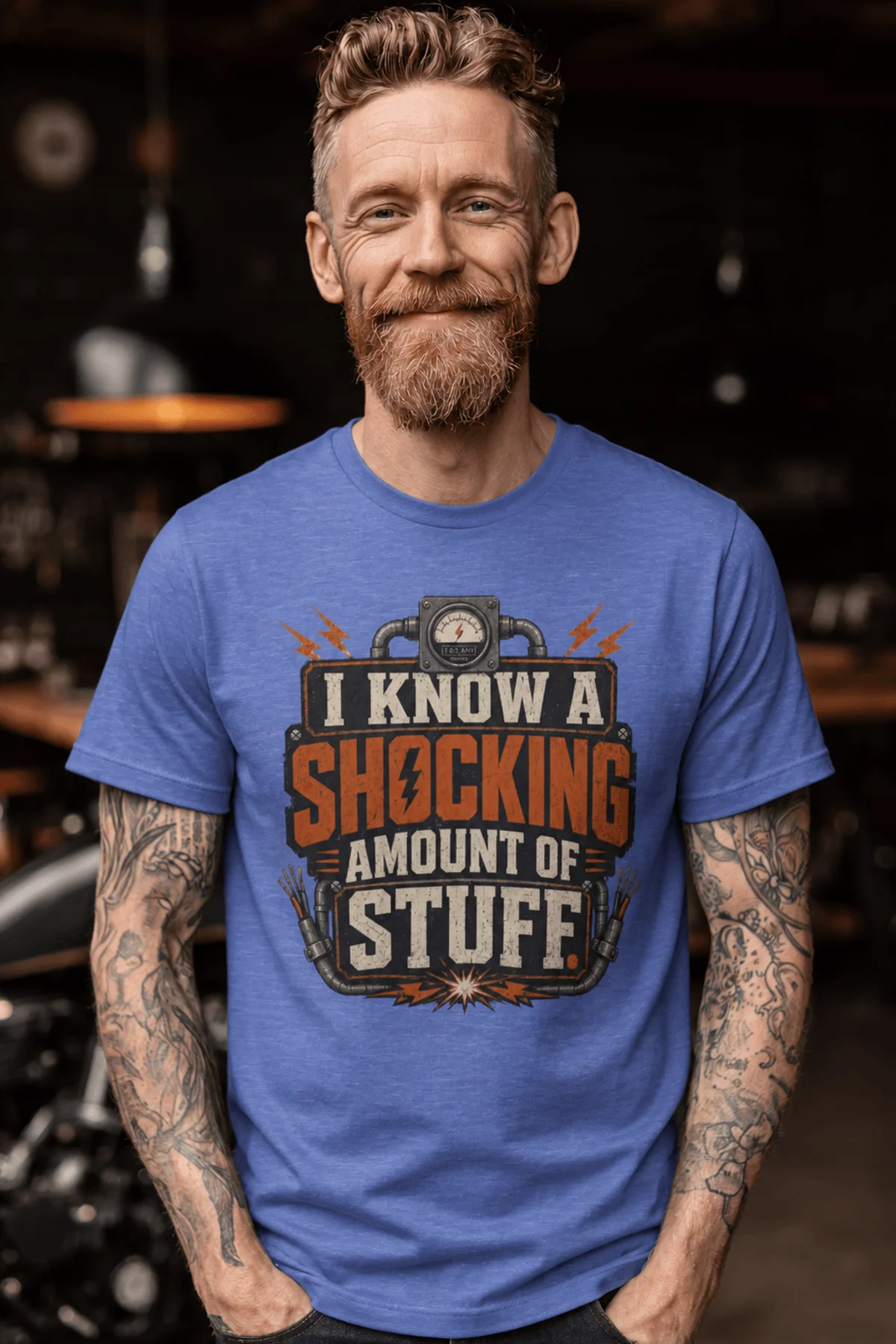 I Know A Shocking Amount Of Stuff T-Shirt — Electrician Science Humorous Tee — heather-columbia-blue t-shirt, model photo | Pressure Tested Co