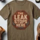 "The Leak Stops Here" Stop Sign Badge Style — Plumbing Repair Tech Humorous Tee — heather-olive t-shirt, flat-lay product photo | Pressure Tested Co