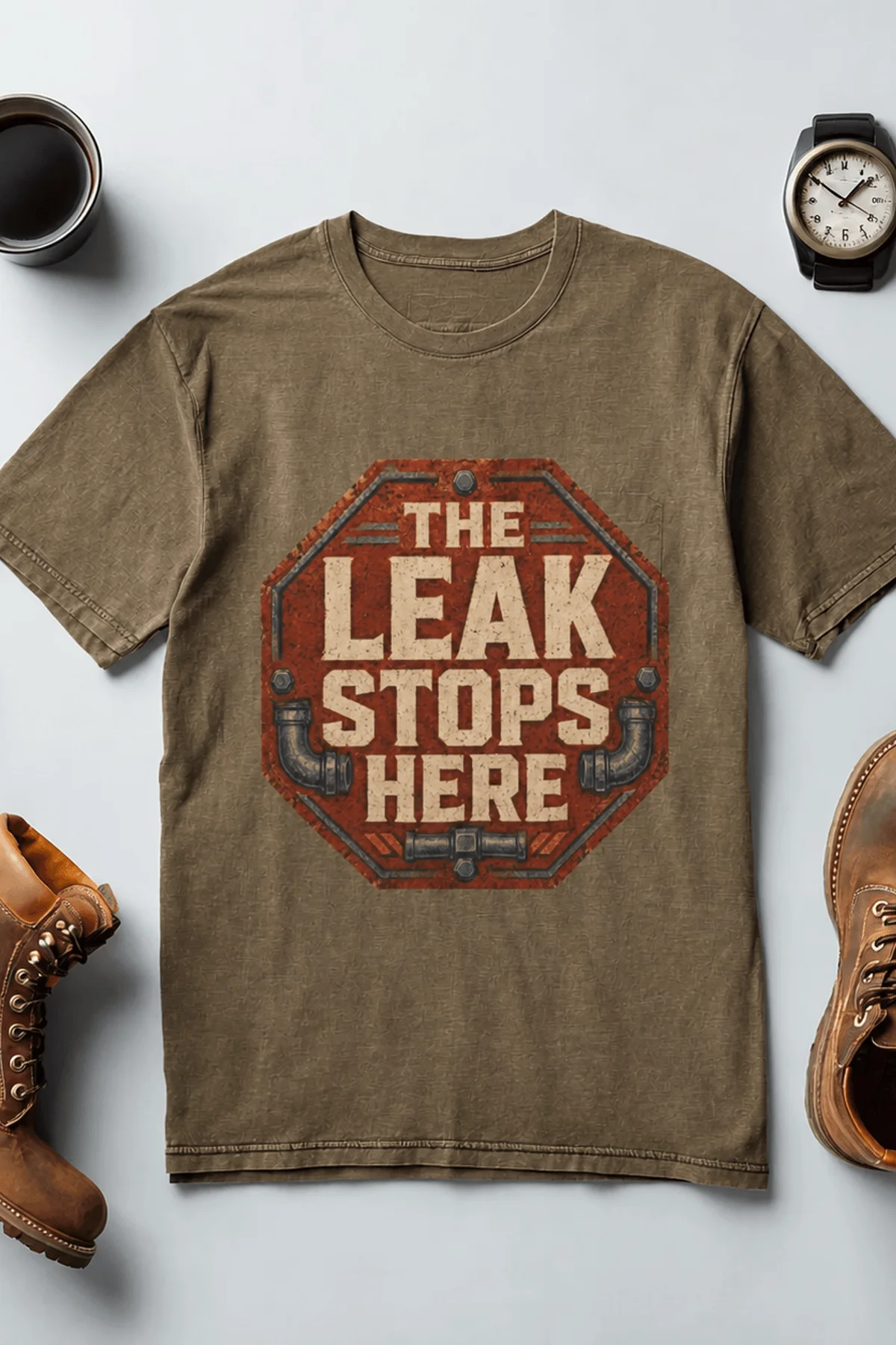 "The Leak Stops Here" Stop Sign Badge Style — Plumbing Repair Tech Humorous Tee — heather-olive t-shirt, flat-lay product photo | Pressure Tested Co