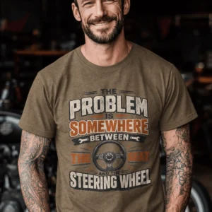 Driving Humor T-Shirt — "The Problem Is Somewhere Between The Seat And The Steering Wheel" — heather-olive t-shirt, model photo | Pressure Tested Co