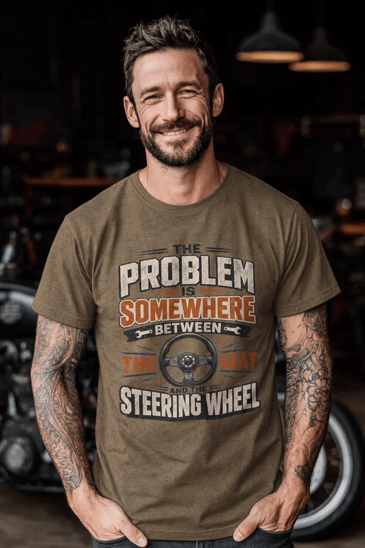 Driving Humor T-Shirt — "The Problem Is Somewhere Between The Seat And The Steering Wheel" — heather-olive t-shirt, model photo | Pressure Tested Co