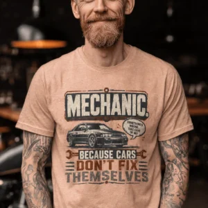 Mechanic Tee — "Mechanic. Because Cars Don't Fix Themselves" Funny Vintage Auto Technician Repair Shirt — heather-peach t-shirt, model photo | Pressure Tested Co