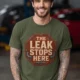 "The Leak Stops Here" Stop Sign Badge Style — Plumbing Repair Tech Humorous Tee — military-green t-shirt, model photo | Pressure Tested Co