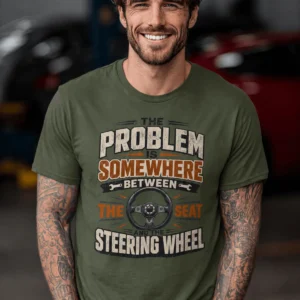 Driving Humor T-Shirt — "The Problem Is Somewhere Between The Seat And The Steering Wheel" — military-green t-shirt, model photo | Pressure Tested Co
