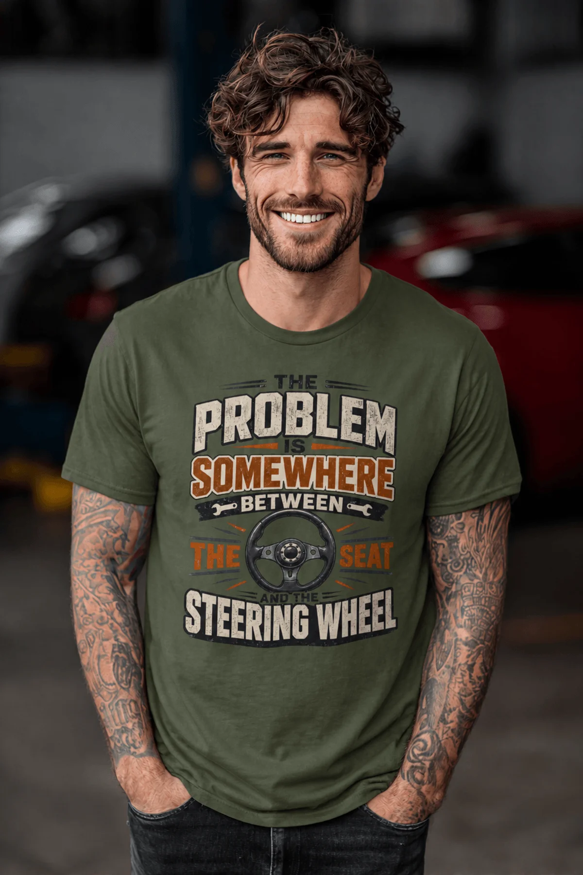 Driving Humor T-Shirt — "The Problem Is Somewhere Between The Seat And The Steering Wheel" — military-green t-shirt, model photo | Pressure Tested Co