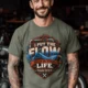 'I Put The Flow Back Into Your Life.' T-Shirt — Funny Retro Industrial Plumber's Tee — moss t-shirt, model photo | Pressure Tested Co