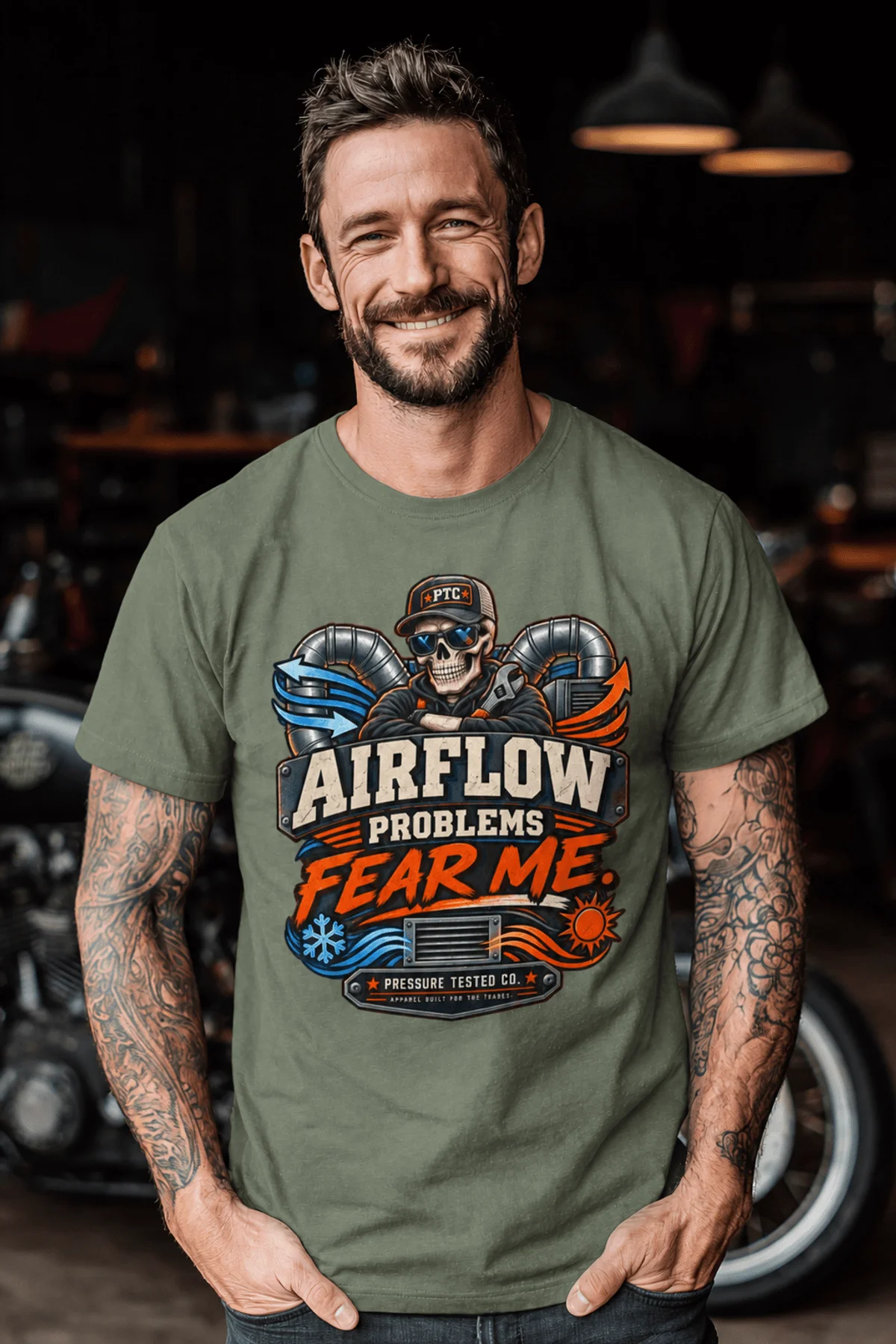 Airflow Problems Fear Me T-Shirt — HVAC Technician Skull Logo Tee — moss t-shirt, model photo | Pressure Tested Co