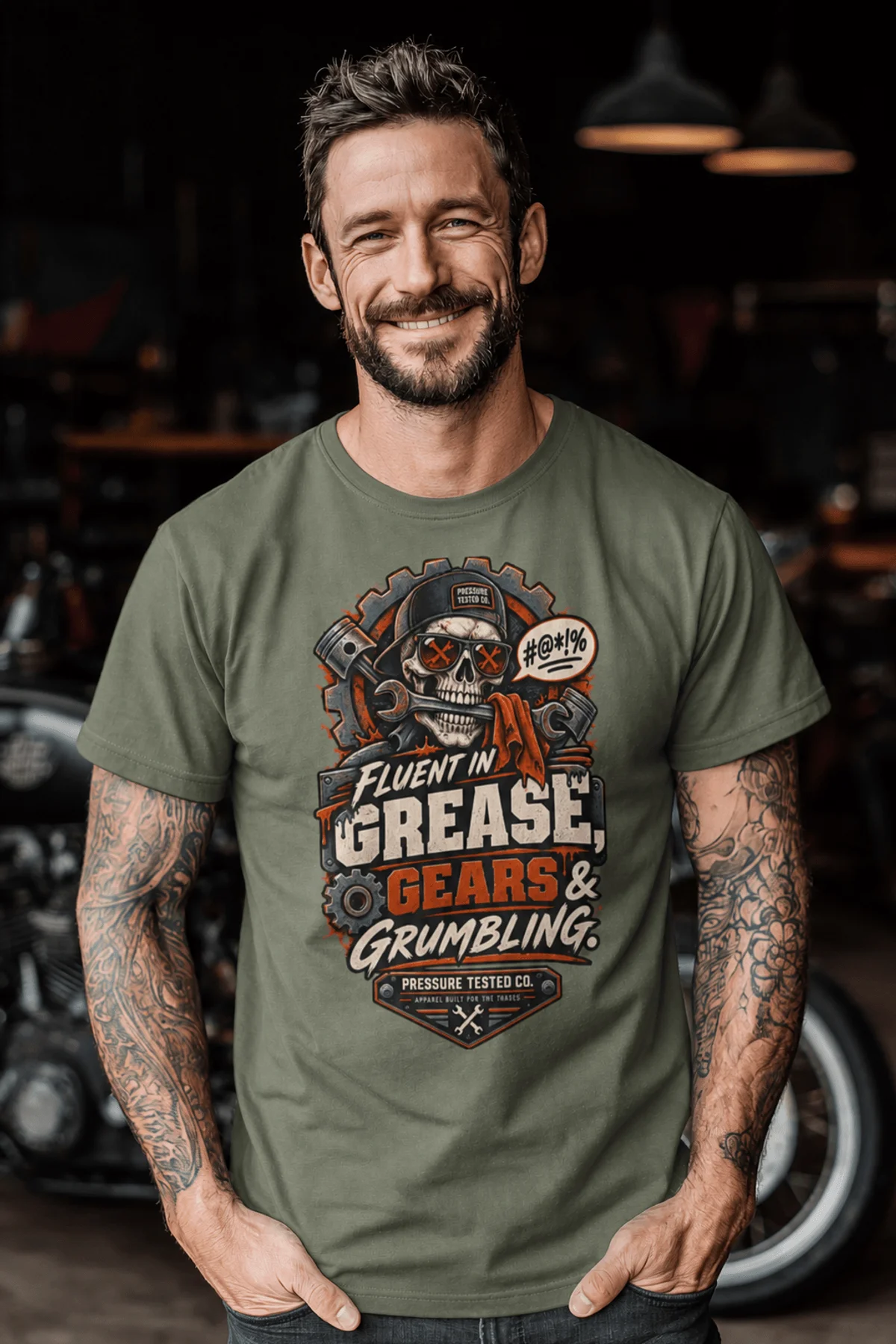 Mechanic Skull T-Shirt — "Fluent in Grease, Gears and Grumbling" Graphic Tee — moss t-shirt, model photo | Pressure Tested Co