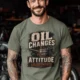 'Oil Changes and Attitude Adjustments' T-Shirt — Funny Retro Industrial Mechanic's Tee — moss t-shirt, model photo | Pressure Tested Co