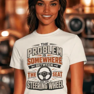 Driving Humor T-Shirt — "The Problem Is Somewhere Between The Seat And The Steering Wheel" — natural t-shirt, model photo | Pressure Tested Co