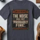 Warning Sign T-Shirt — "The Noise Was Not 'Probably Fine'" Vintage Graphic Tee — navy t-shirt, flat-lay product photo | Pressure Tested Co