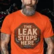"The Leak Stops Here" Stop Sign Badge Style — Plumbing Repair Tech Humorous Tee — orange t-shirt, model photo | Pressure Tested Co