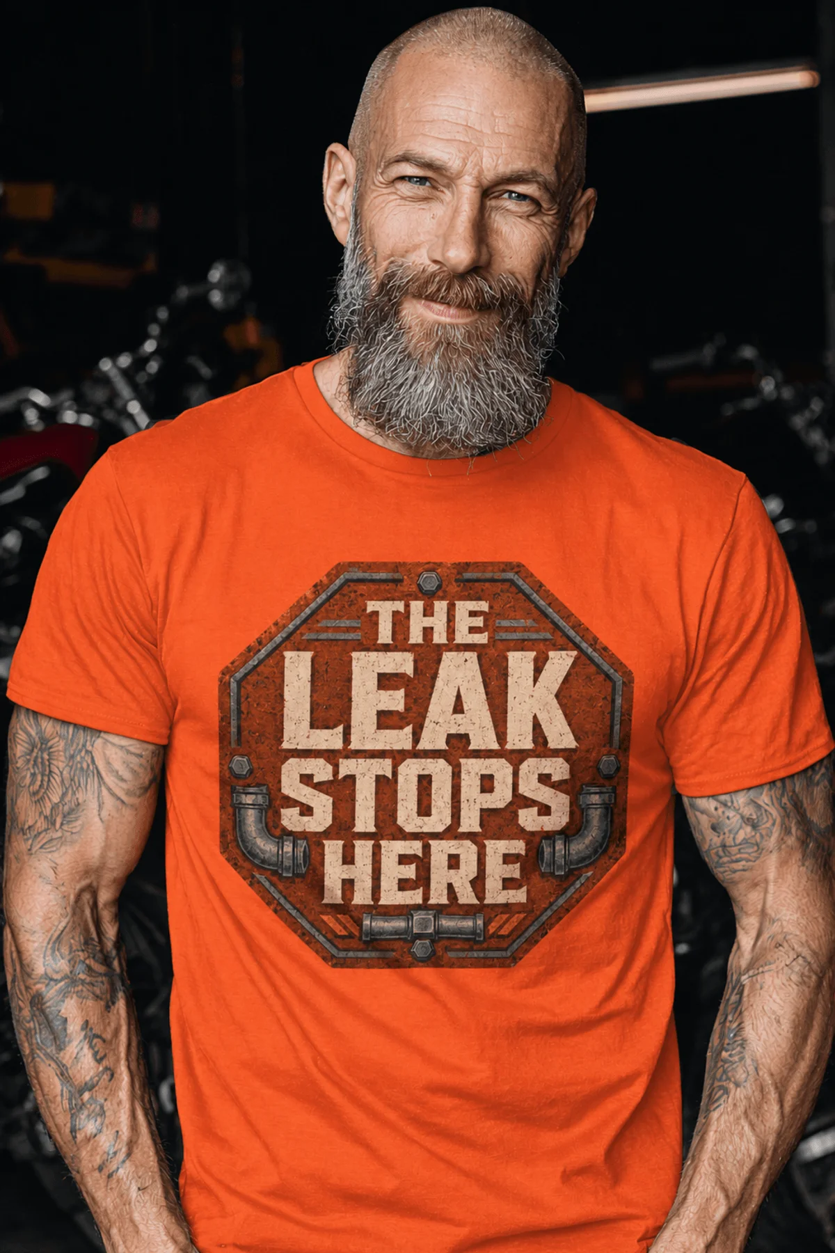 "The Leak Stops Here" Stop Sign Badge Style — Plumbing Repair Tech Humorous Tee — orange t-shirt, model photo | Pressure Tested Co