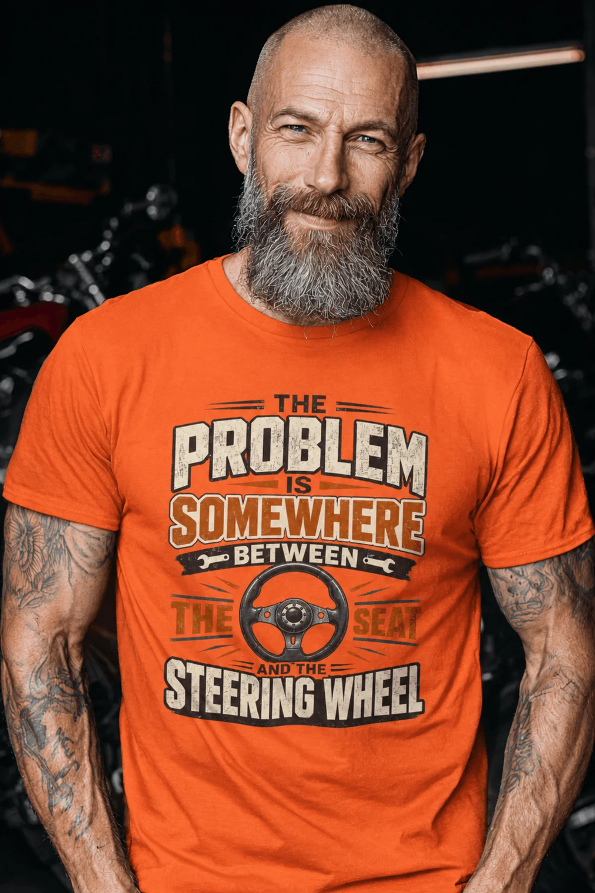 Driving Humor T-Shirt — "The Problem Is Somewhere Between The Seat And The Steering Wheel" — orange t-shirt, model photo | Pressure Tested Co