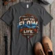 'I Put The Flow Back Into Your Life.' T-Shirt — Funny Retro Industrial Plumber's Tee — pepper t-shirt, flat-lay product photo | Pressure Tested Co